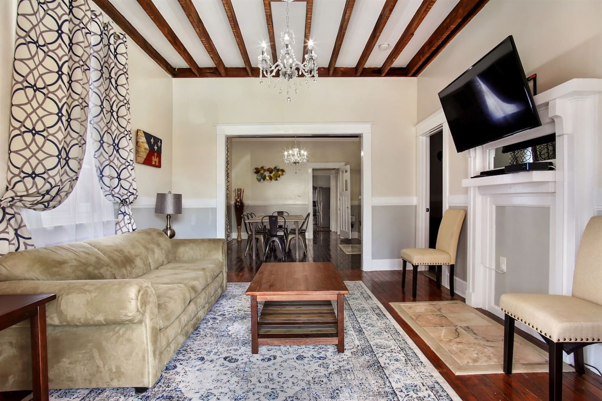 Living room & dining room from entry way. love seat for additional seating.