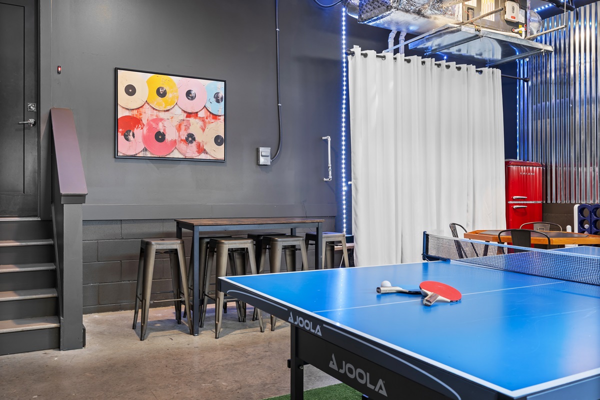Game Room: Dive into fun with lively décor, a ping pong table, and vibrant seating!