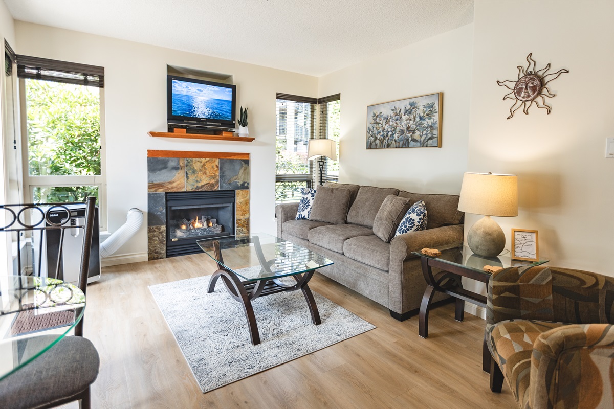 Unit B. Main Floor. Streaming TV. Double glass doors. AC unit / natural gas fireplace. Covered Patio. Open concept. Roomy and spacious. Queen pull out sofa for extra Guests.