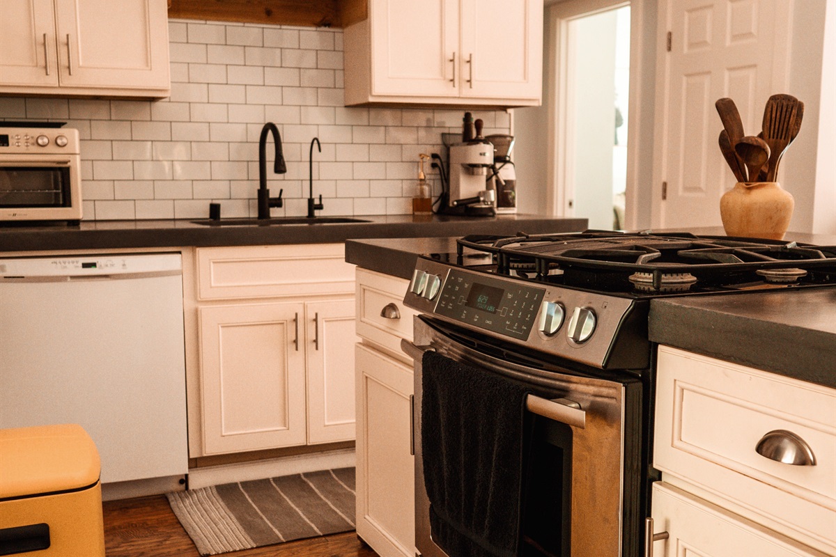 Gourmet kitchenette: fully stocked, sleek countertops and everything you need for a relaxing stay.”