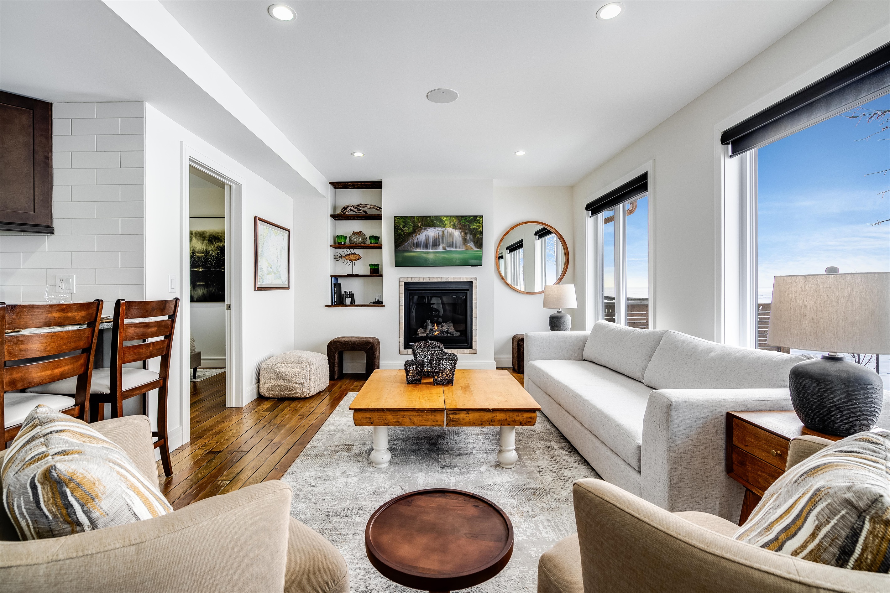 Crisp white walls paired with natural wood finishes.
