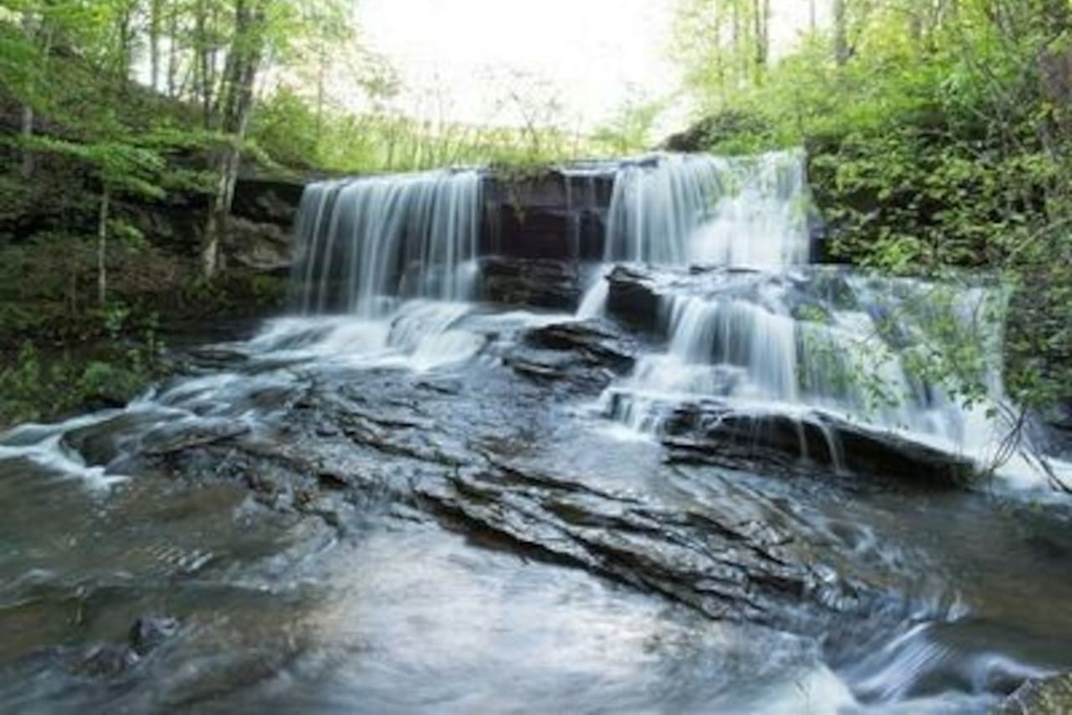 Waterfall directly across from the private beach Mirror Lake: Look for the Nature Walk Sign!
