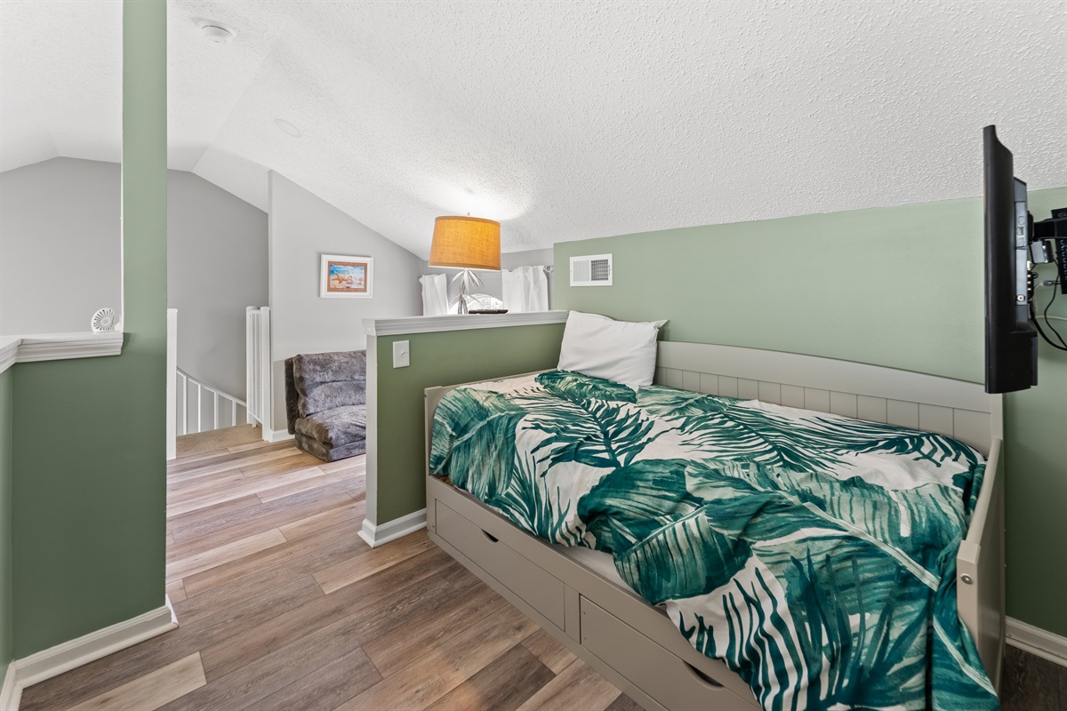 Loft area with twin bed that opens out to a king by pulling out trundle