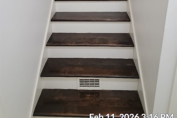 Interior stairs from basement floor to  ground floor from laundry room