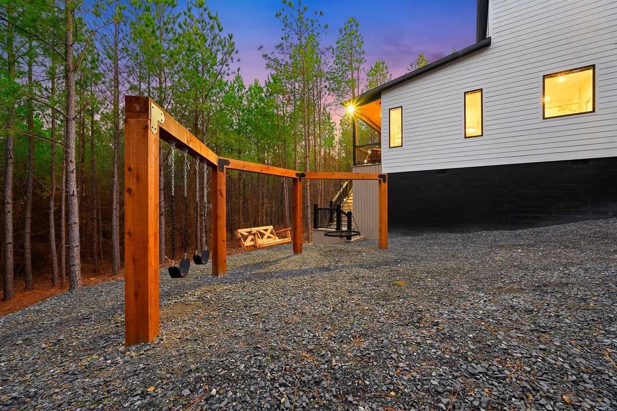 The custom wood swing set creates the perfect space for outdoor memories.