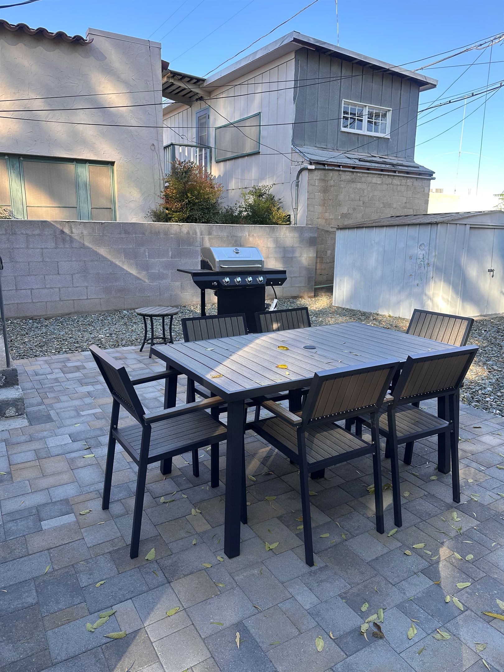 Fenced backyard with gate to access alley and shorter walk to Main Street.  Patio Table for 6 and Gas BBQ Grill.