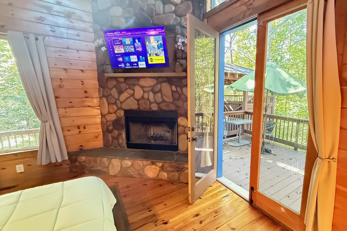 Main Level Bedroom opens to the patio as well