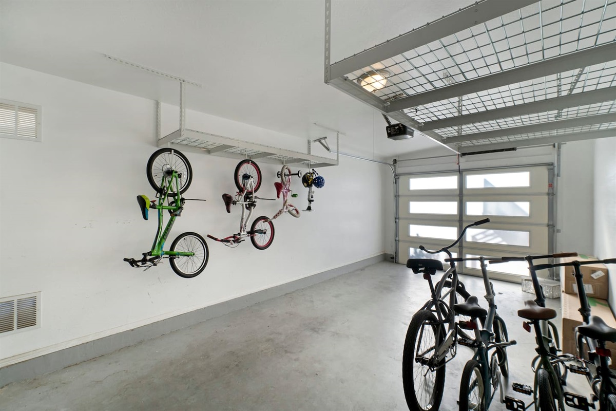 Spacious garage with ample storage and room for vehicles, providing both functionality and organization.