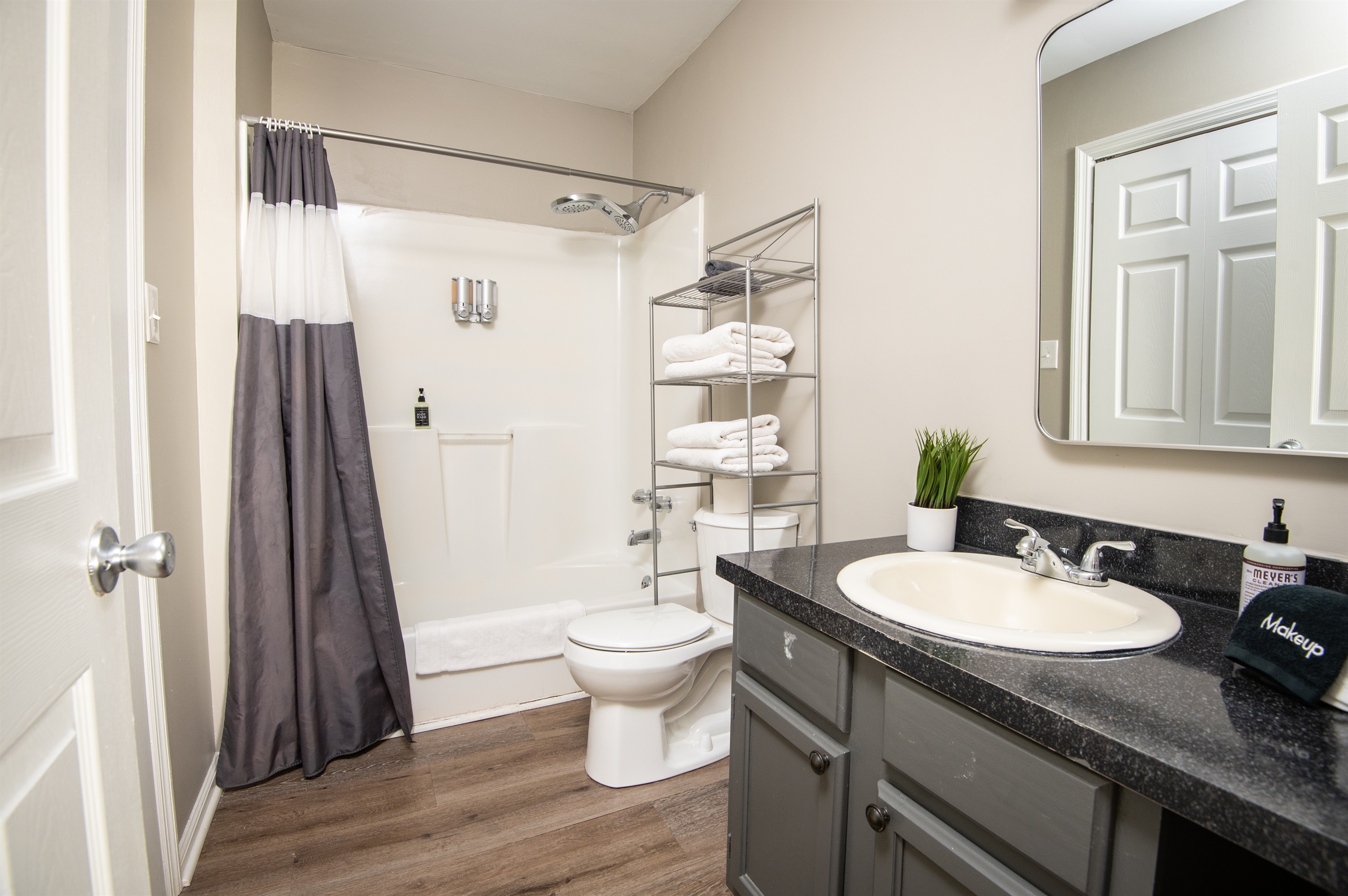 This ensuite bathroom is attached to the double queen room. Both bathrooms come complete with shampoo, body wash, conditioner, hand soap, and all the linens you need for a comfy stay.