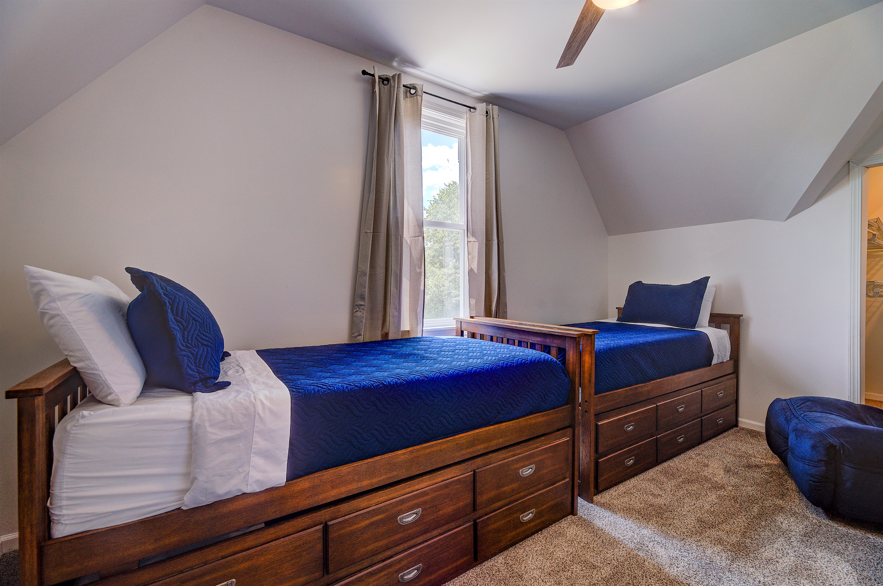 2 captains beds with trundles below