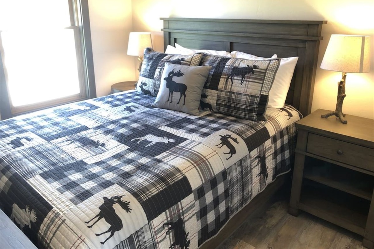 Queen sized bed. Luggage rack and hooks with hangers. 