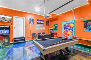 A playful oasis filled with bright orange hues and exciting entertainment options, from pool, airhockey, beerpong and foosball to arcade classics, making this the ultimate spot to unwind and have fun.