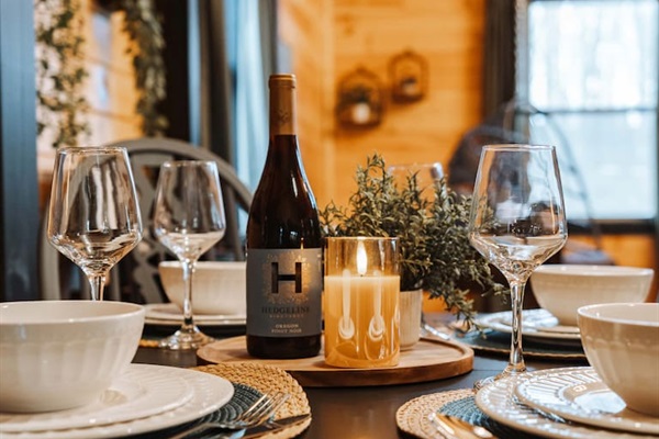 Intimate dining framed by natural timber and shifting forest light