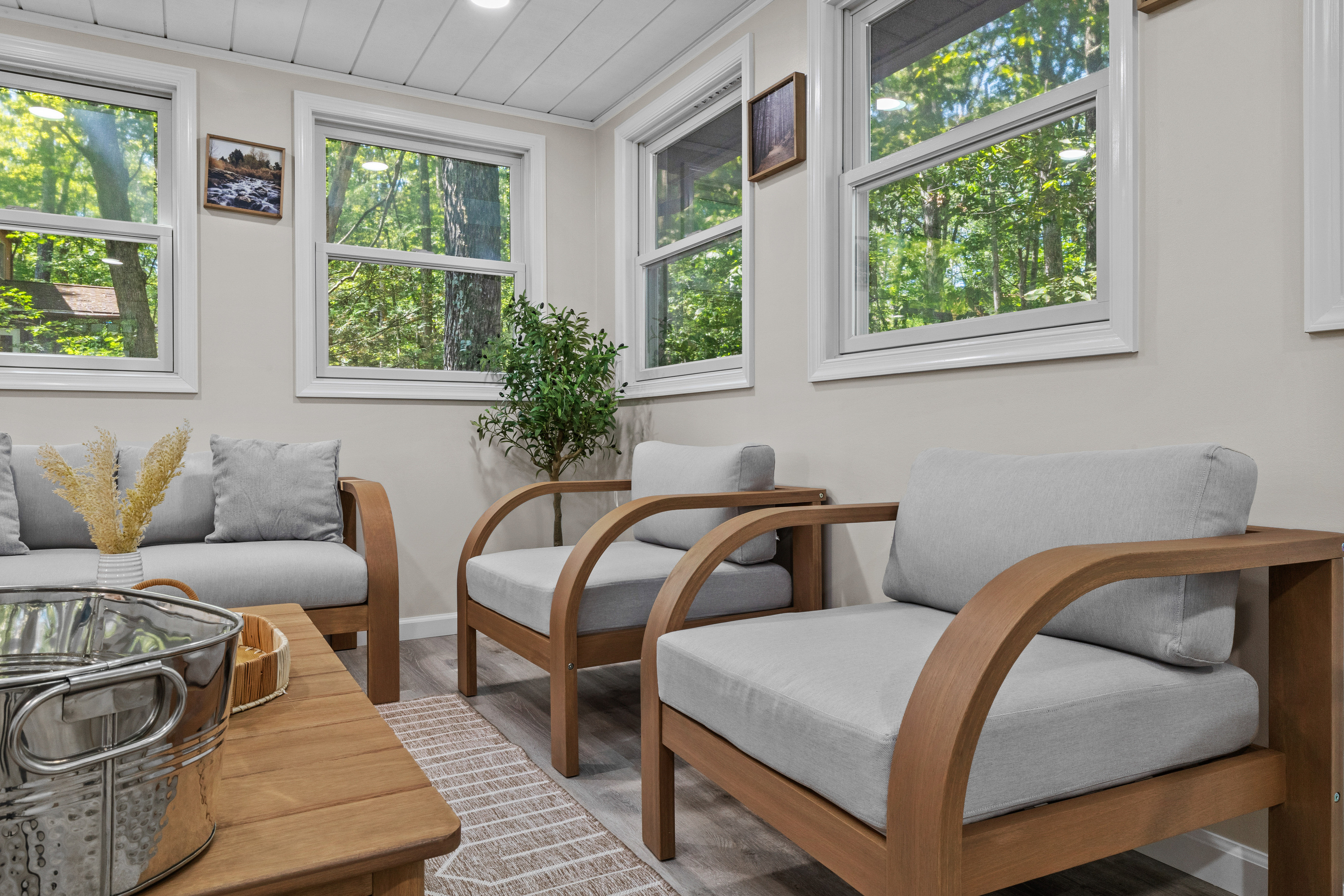 Just steps from the kitchen, the sunroom offers a quiet, extra retreat to read, relax, or simply look out at nature