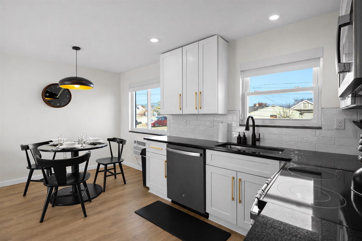 Bright, open kitchen and dining space with modern finishes, ample counter space, and natural light—perfect for cooking, dining, and everyday living.