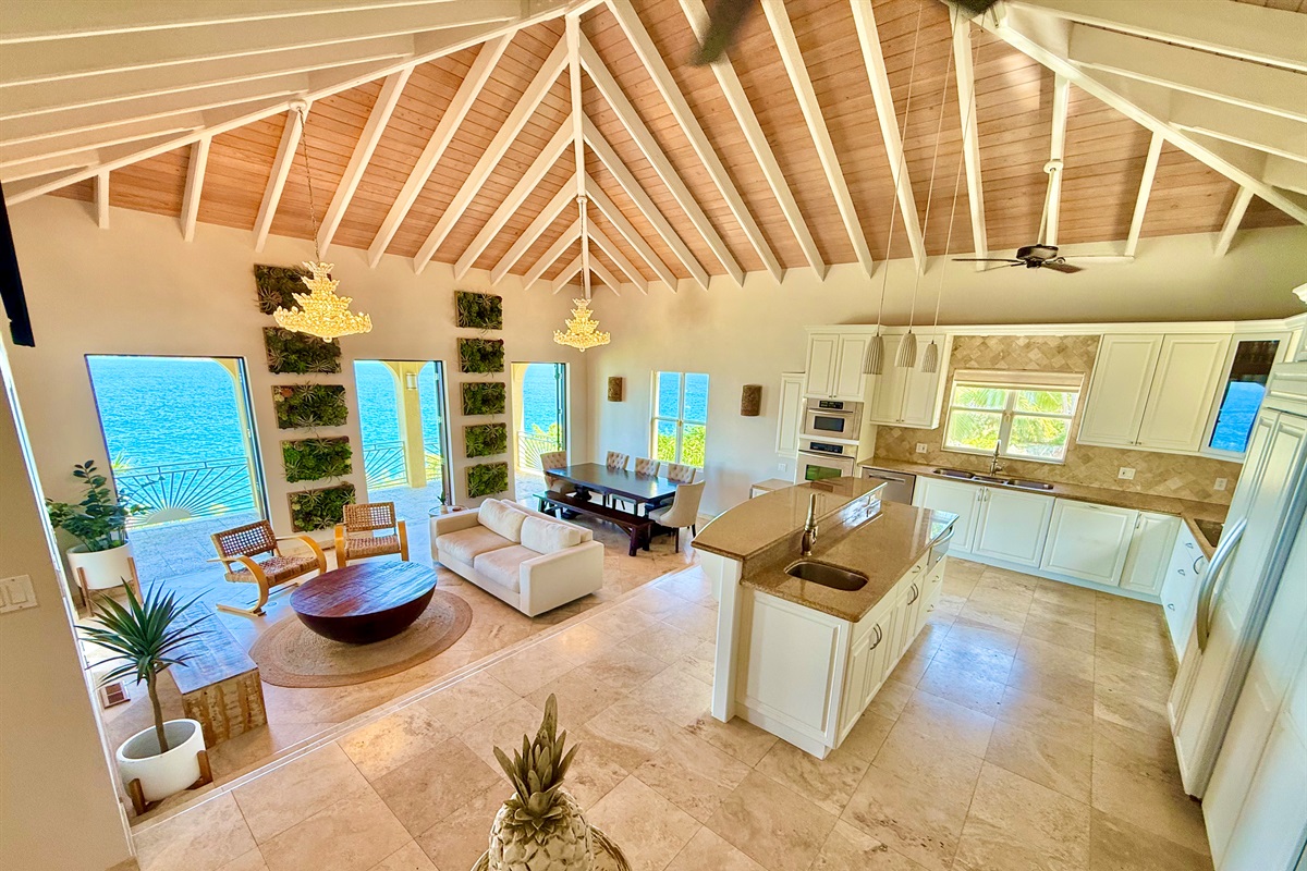 Bright, airy living space designed for gathering—dine, lounge, and enjoy the sea breeze with views.