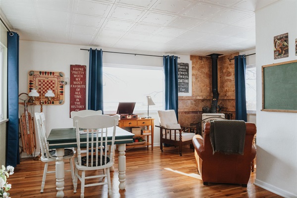 A game table, record player, a cozy conversation corner, and enormous picture windows make this space a guest favorite.  