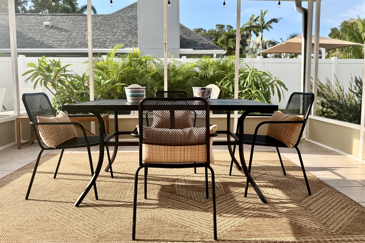 With chic patio furniture, lush greenery, and a crystal-clear heated pool, you won’t want to leave this backyard.