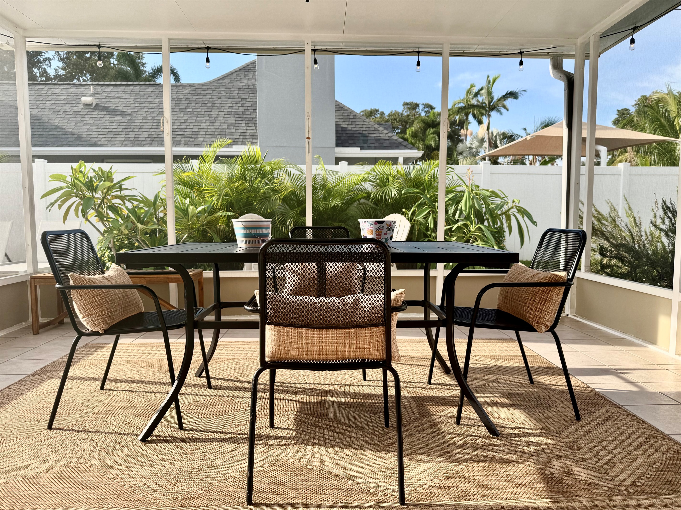 With chic patio furniture, lush greenery, and a crystal-clear heated pool, you won’t want to leave this backyard.