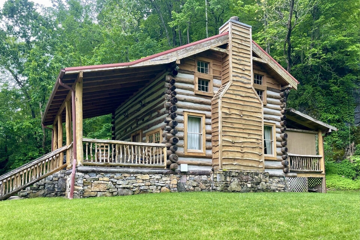 The cabin is a work of art, made of of timbers and riverstone