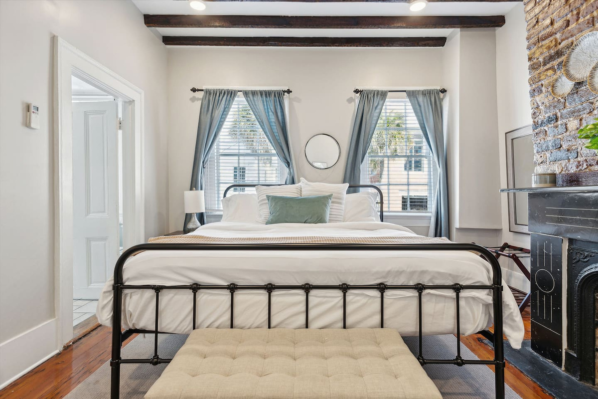 Bedroom #1 is on the main floor, has a King size bed, fireplace feature, closet and dresser. Has a full-bath en-suite with a bathtub/shower combo.  Comes equipped with shampoo & conditioner, body soap, and blow dryer. 