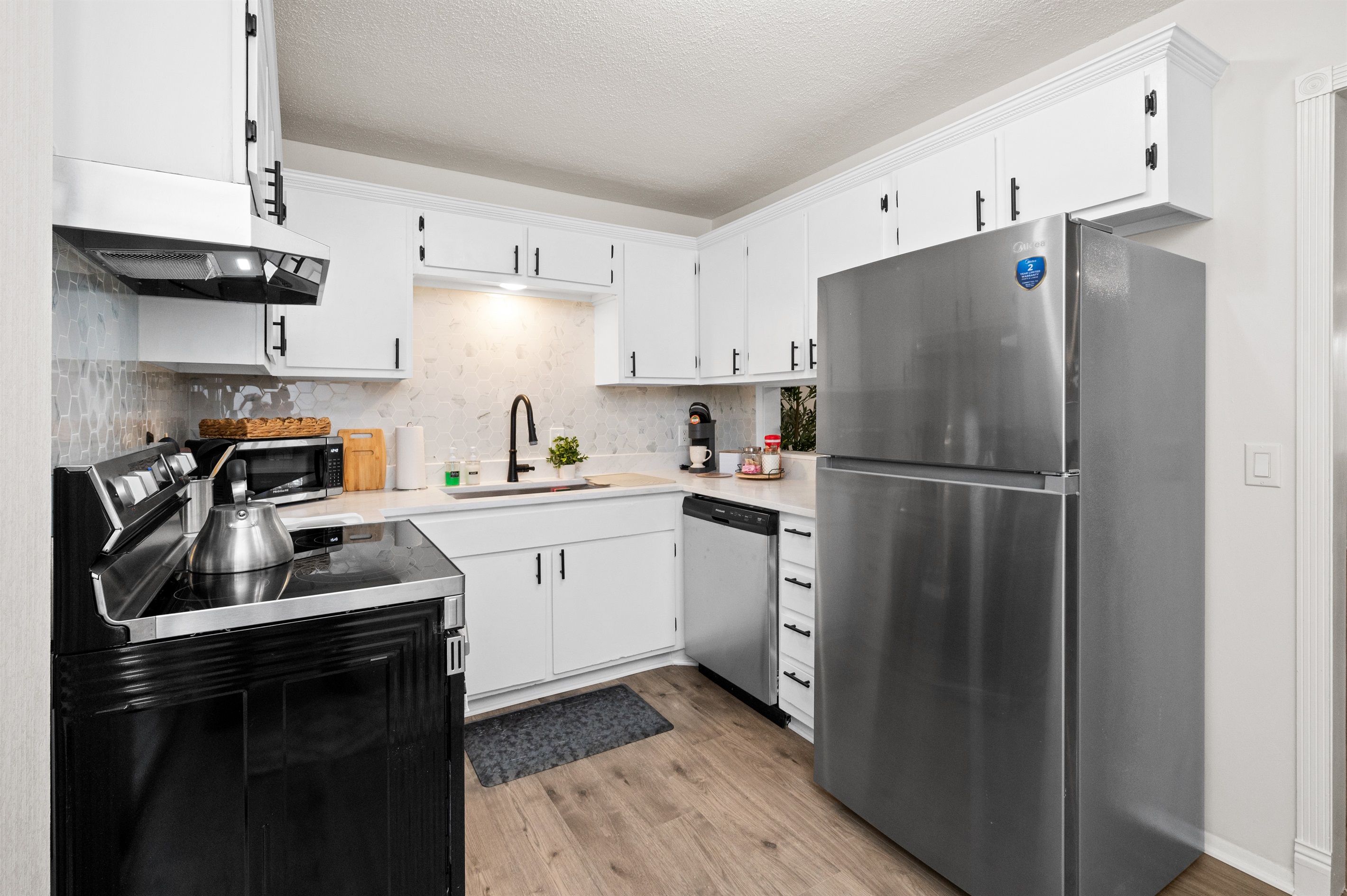 Another look inside the well-equipped kitchen and large refrigerator that can hold anything and everything you need!