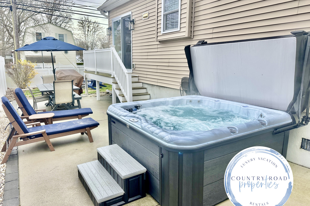 Nothing beats a long soak in the hot tub after a day at the beach! This patio is a true vacation oasis, featuring bubbling jets, comfy lounge chairs for sunbathing, and a nice shaded table for outdoor dining.