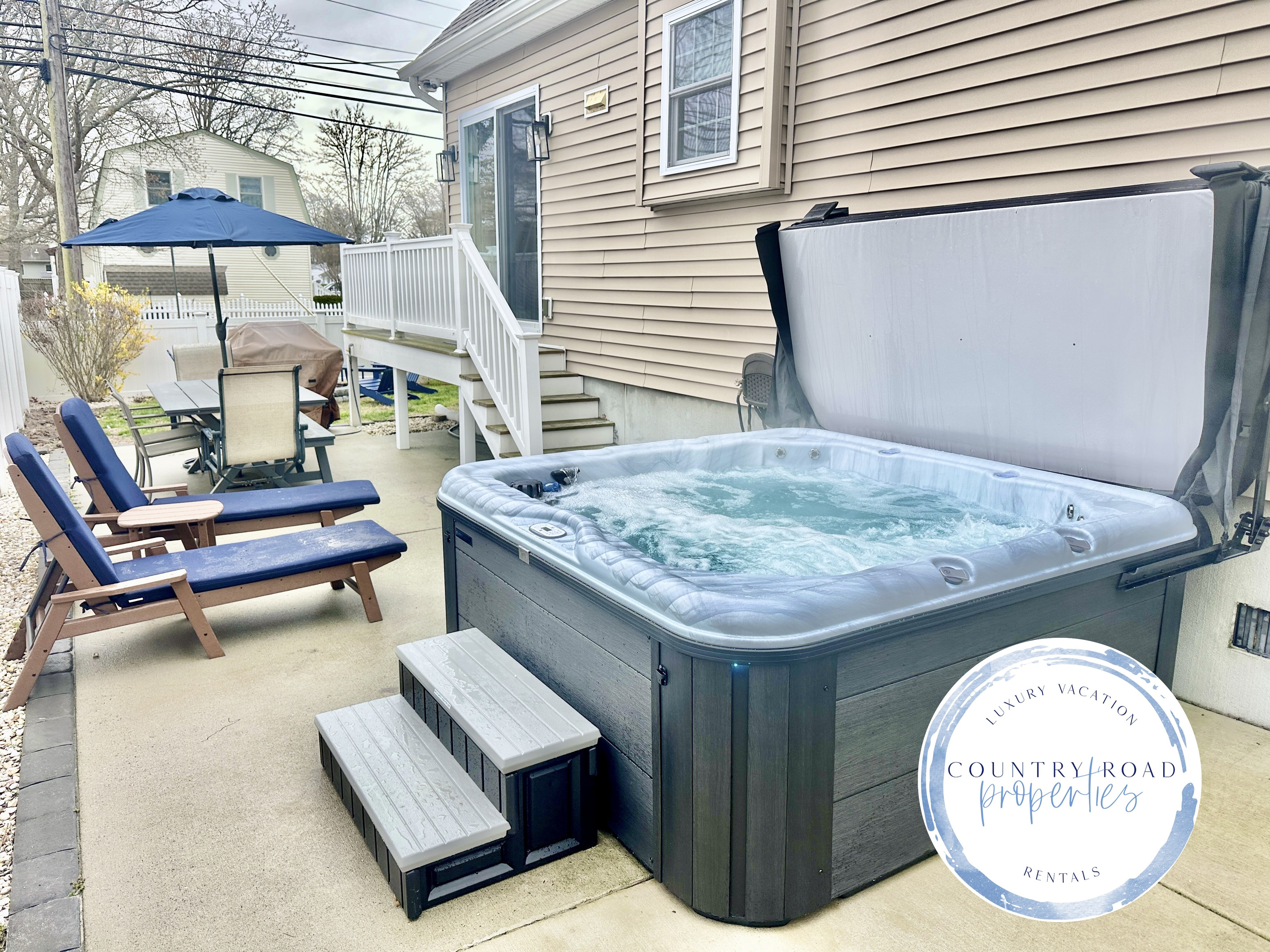 Nothing beats a long soak in the hot tub after a day at the beach! This patio is a true vacation oasis, featuring bubbling jets, comfy lounge chairs for sunbathing, and a nice shaded table for outdoor dining.