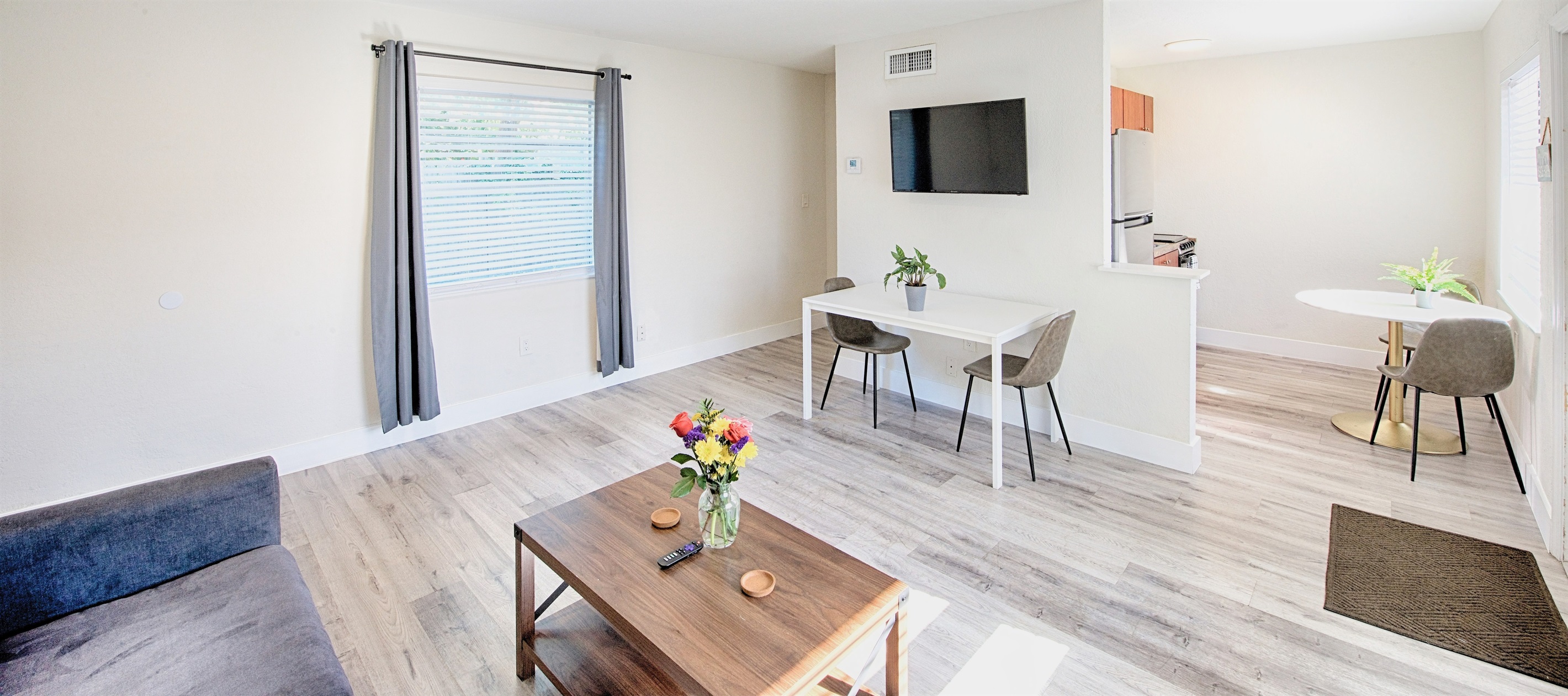Featuring 40" inch smart TV with work station. View of kitchen entry