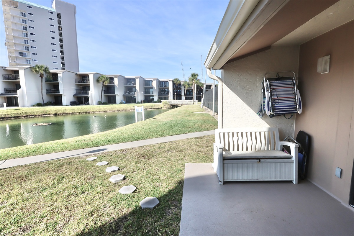 Ground floor patio with views of pool & pond