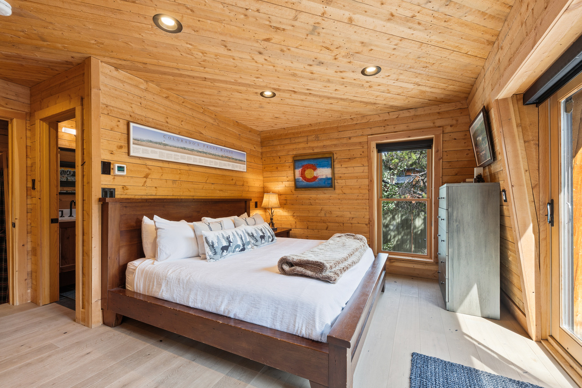 Upper level junior suite with King bed and private balcony