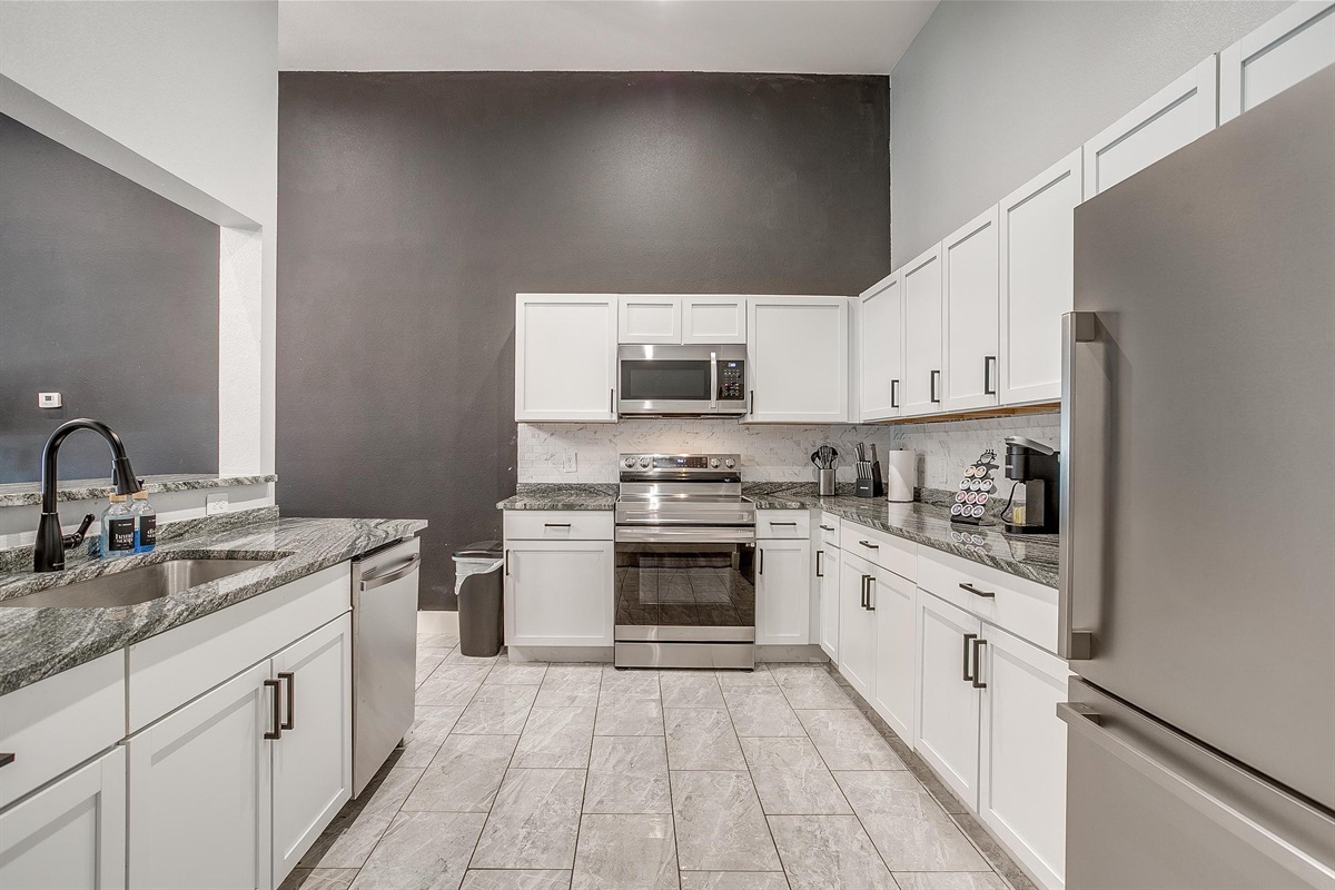 View from kitchen into the bright and stylish living space.