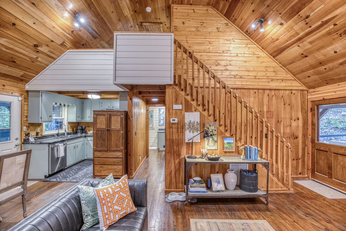 Living area with a staircase to the loft.