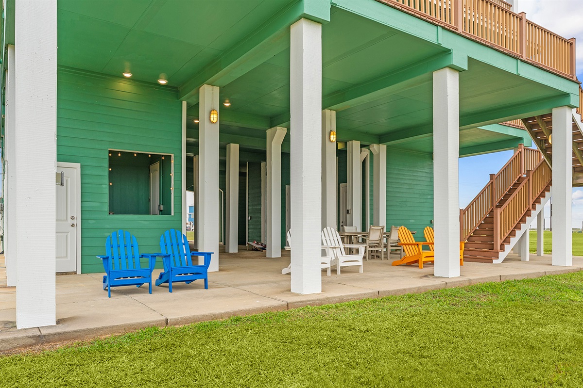 Exterior: Ground level patio with summer kitchen and propane grill.