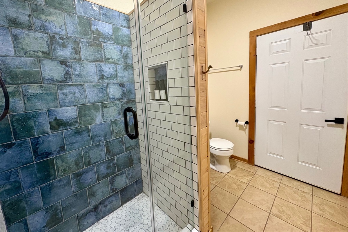 Custom tile shower in the ground floor bath.