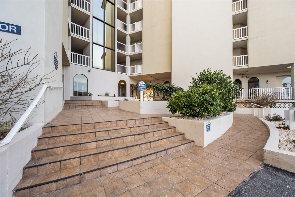 Entrance to St Regis Building 1 with stairs and ramp access