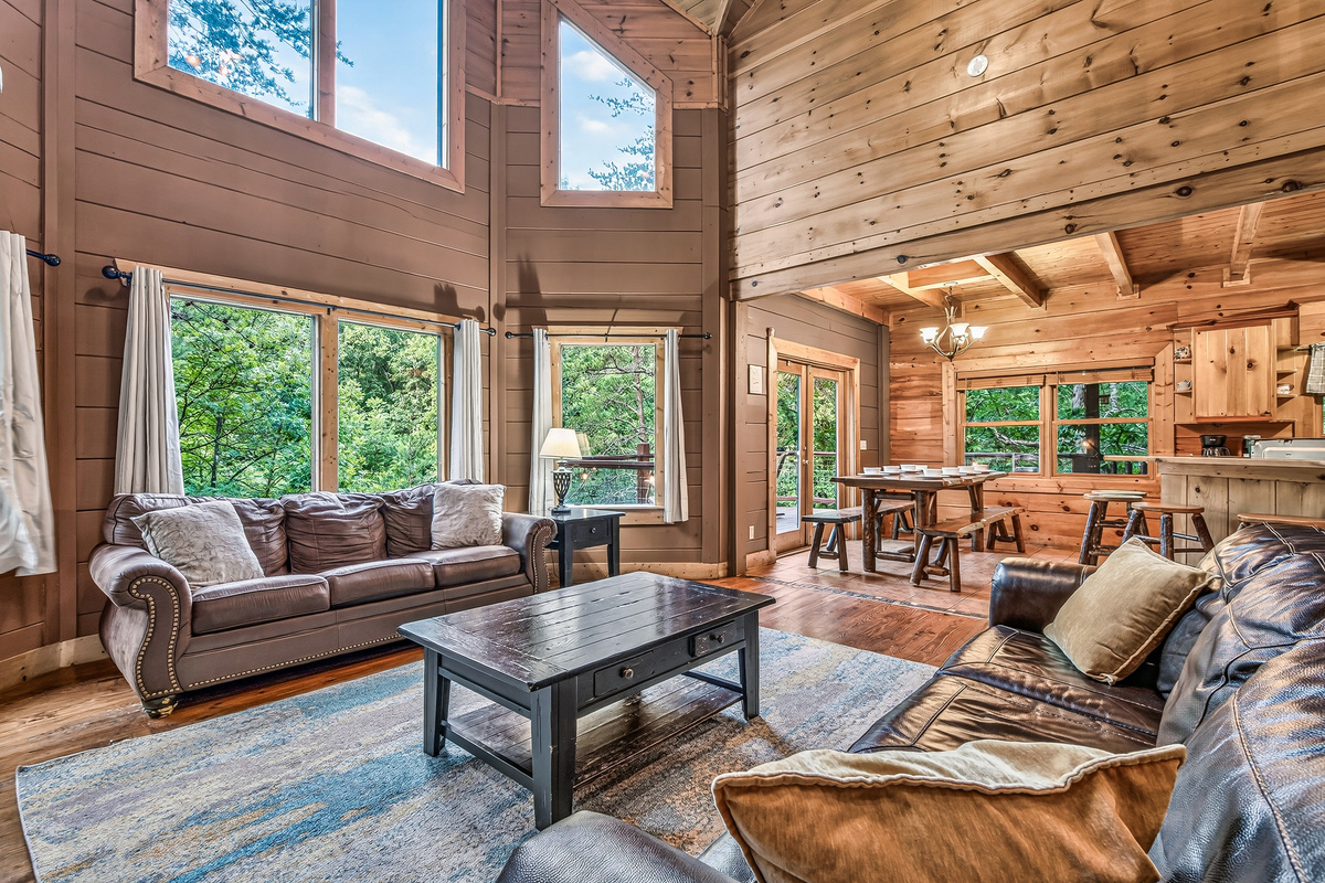 Soak in the natural light, glowing warmth, and scenic forest surroundings all from one cozy spot.