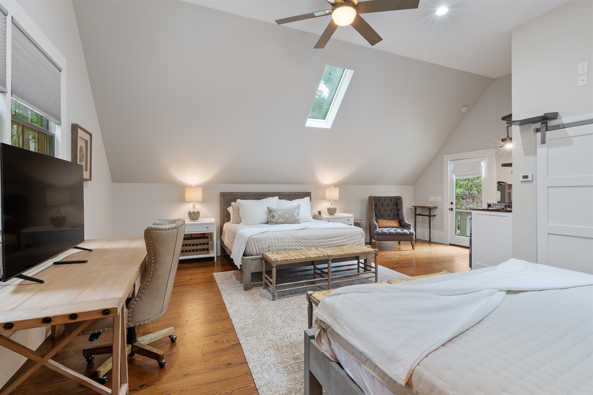 The carriage house includes a desk and TV, perfect for work or relaxation during your stay.