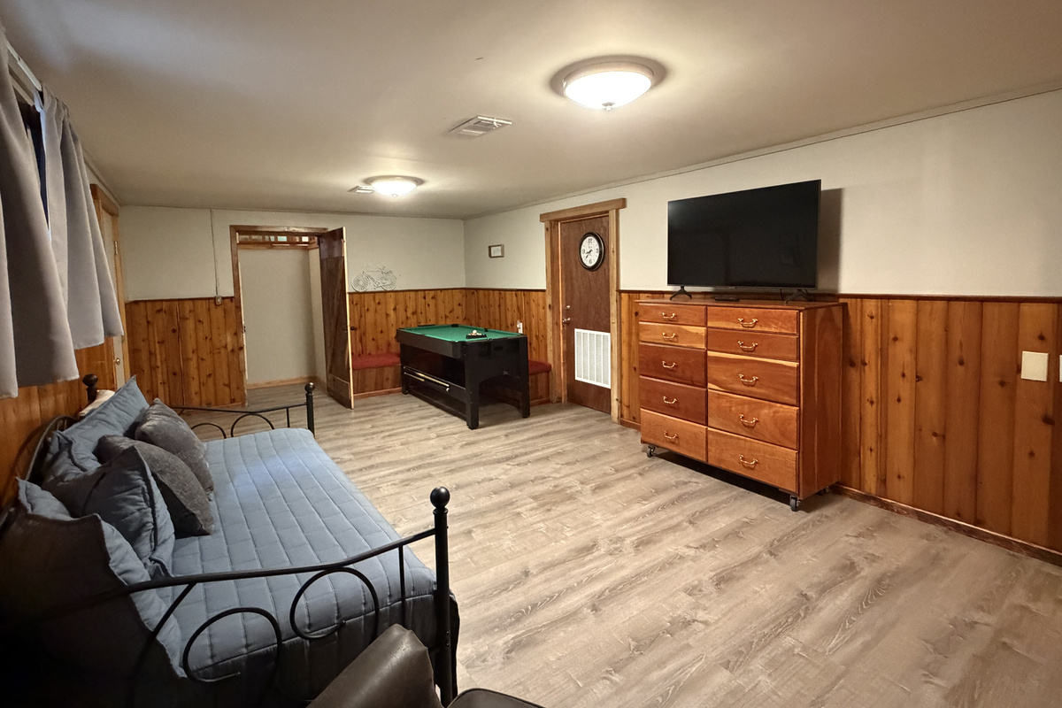 Lower level gameroom with mini pool table and SmartTV