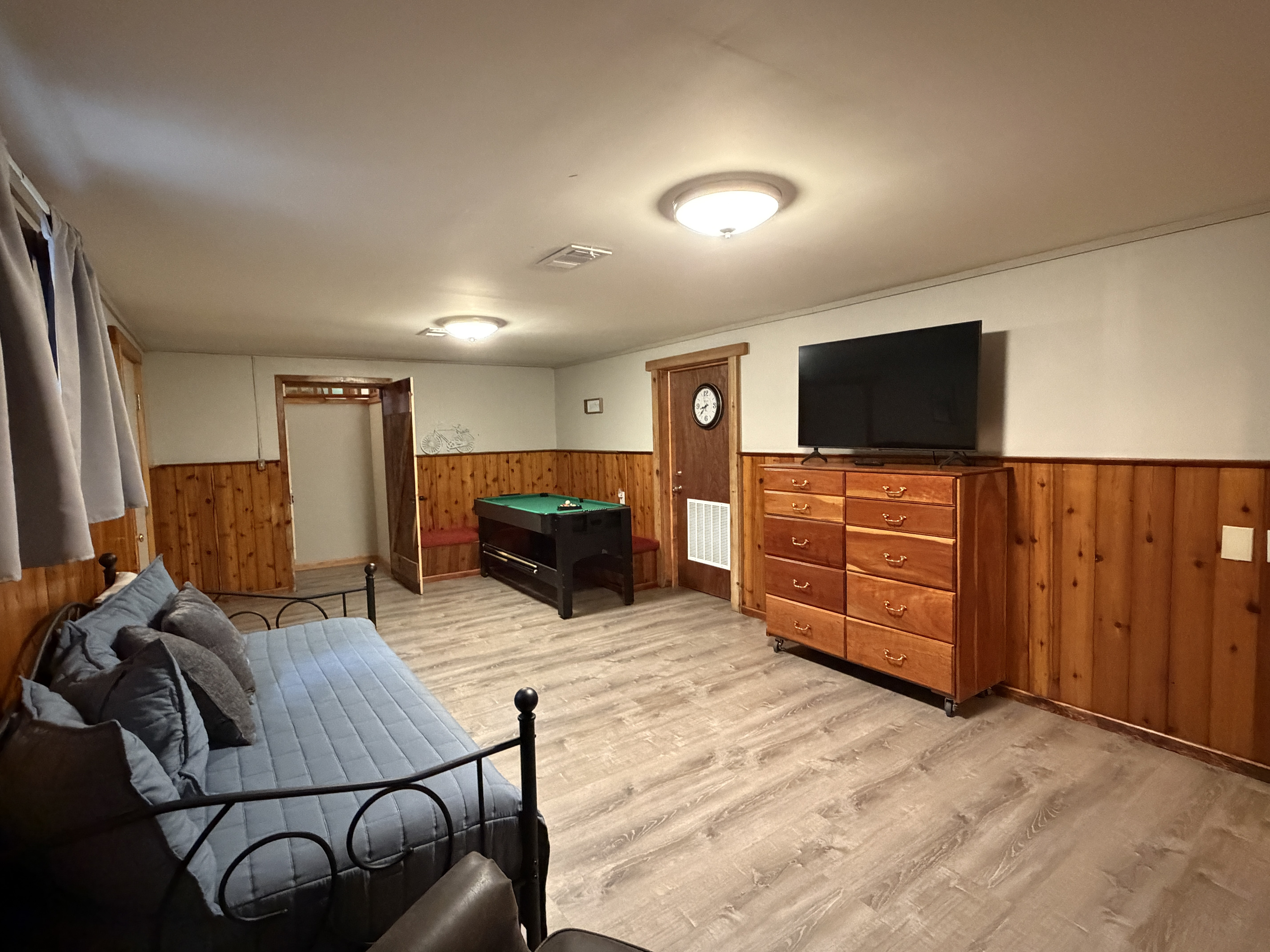 Lower level gameroom with mini pool table and SmartTV