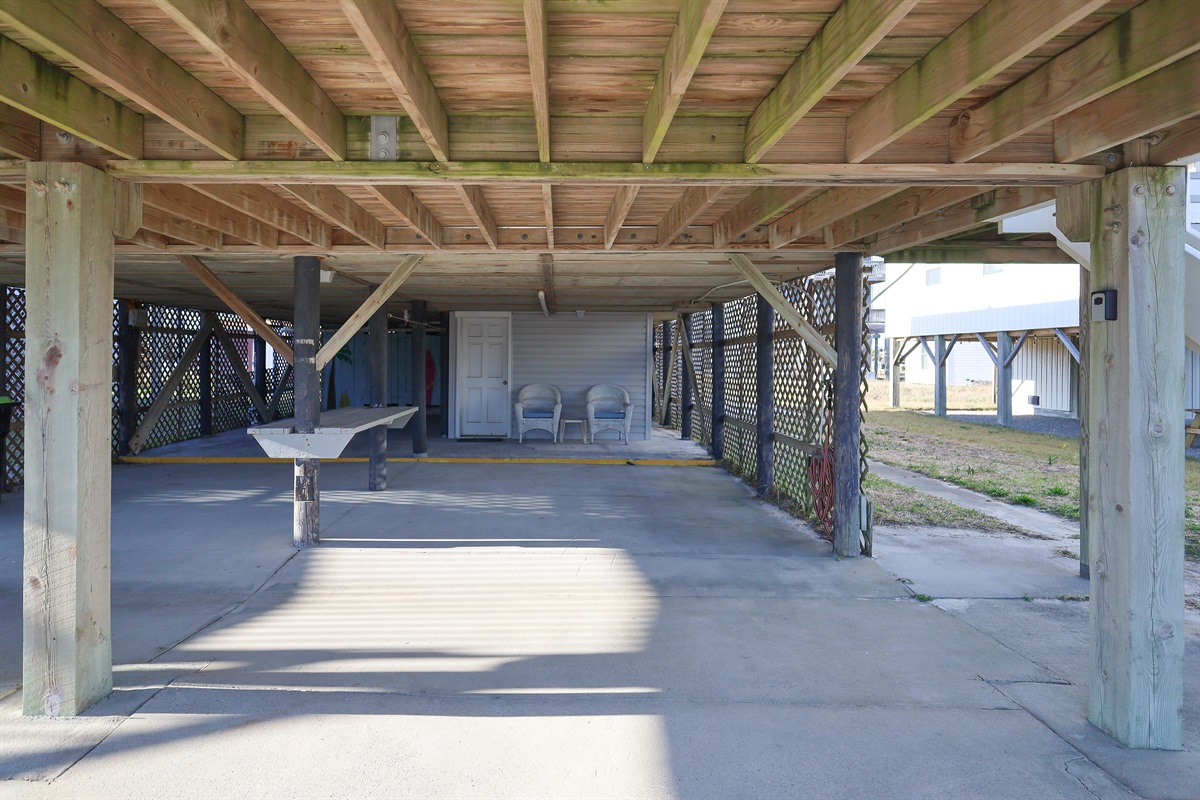 Spacious covered carport with plenty of room for multiple vehicles
