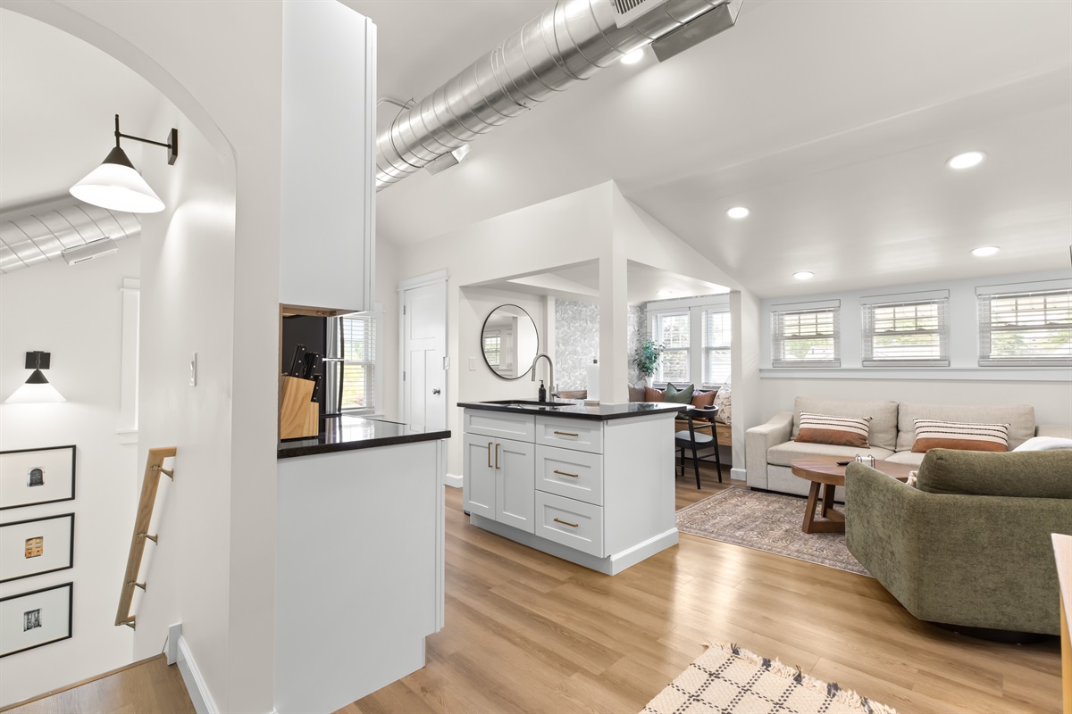 Spacious open-concept layout with a fully equipped kitchen, dining nook, and comfy living area—all in one inviting space.