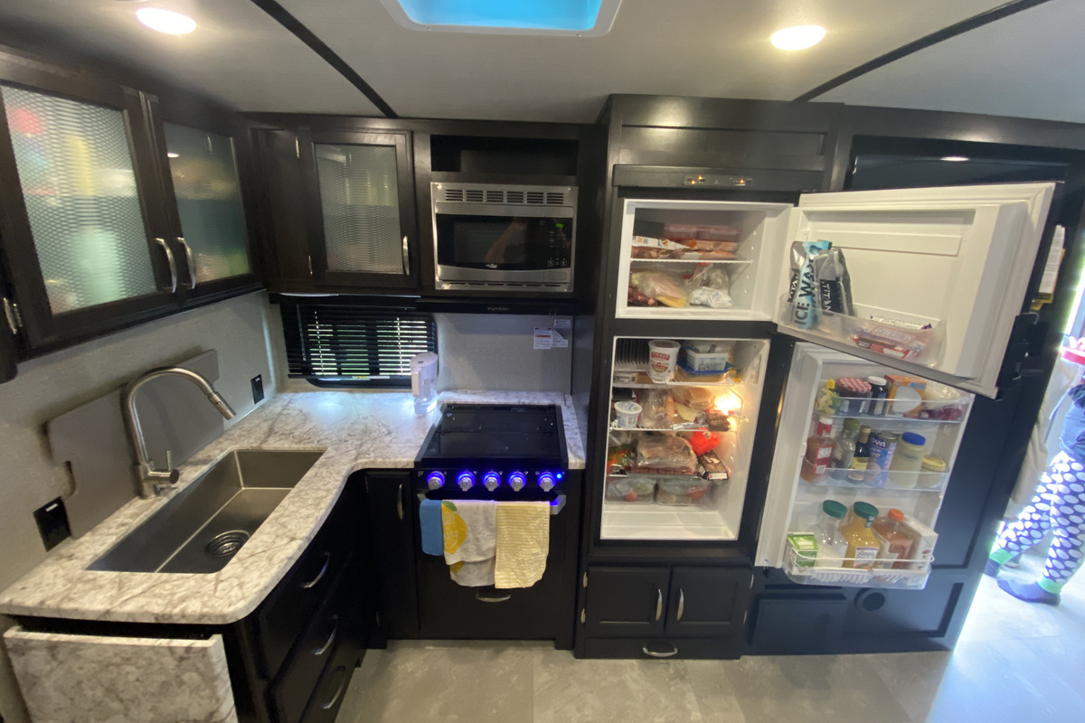 The kitchen comes with a full sized fridge & freezer, stove and oven, microwave and ample storage. Fully equipped with all cookware, utensils and basics for cooking