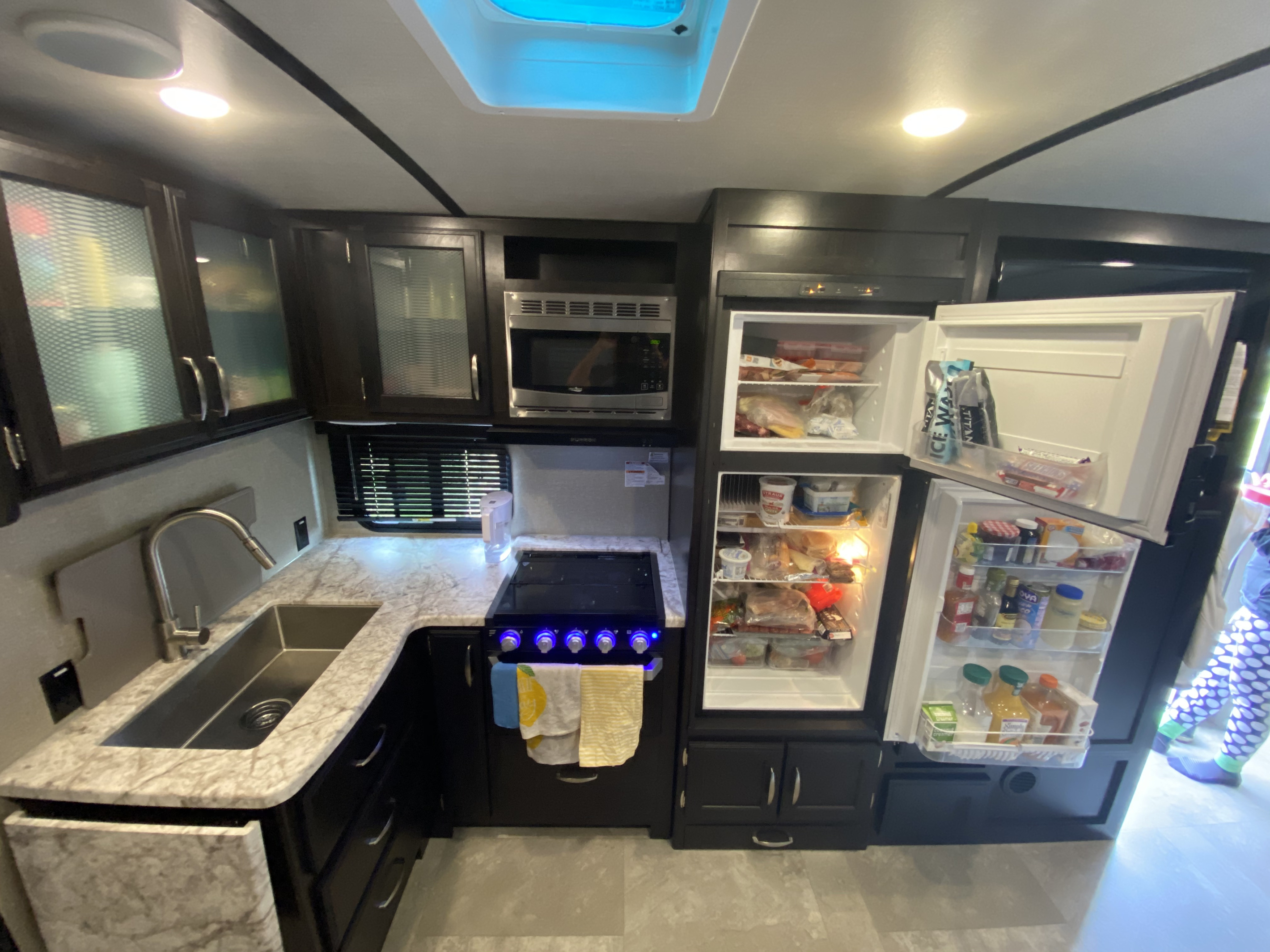 The kitchen comes with a full sized fridge & freezer, stove and oven, microwave and ample storage. Fully equipped with all cookware, utensils and basics for cooking