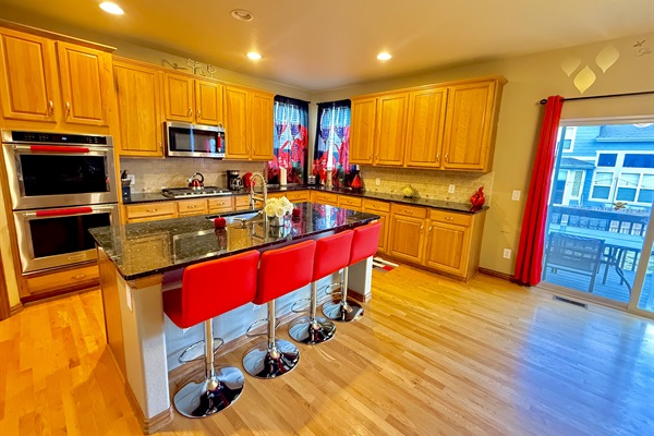 Spacious kitchen with elegant granite countertops, perfect for cooking and entertaining