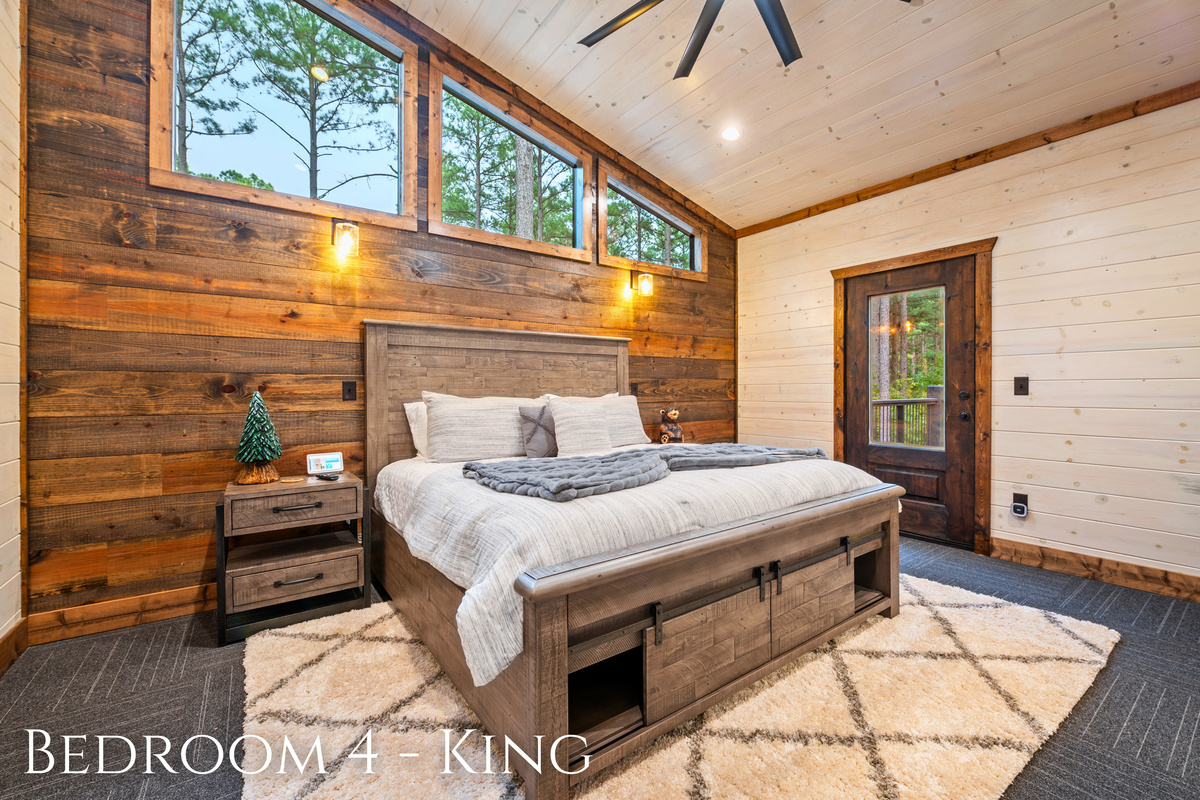 A peaceful king bedroom with natural touches and forest views, designed for the ultimate relaxation.