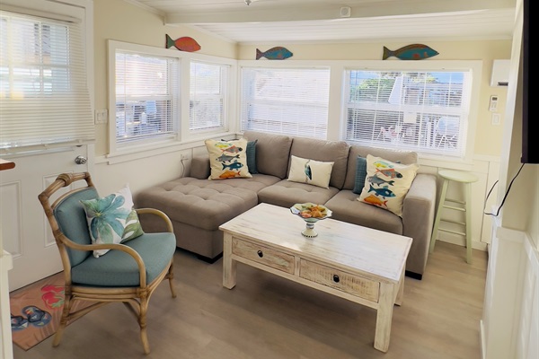 Living room with large television and sleeper sofa