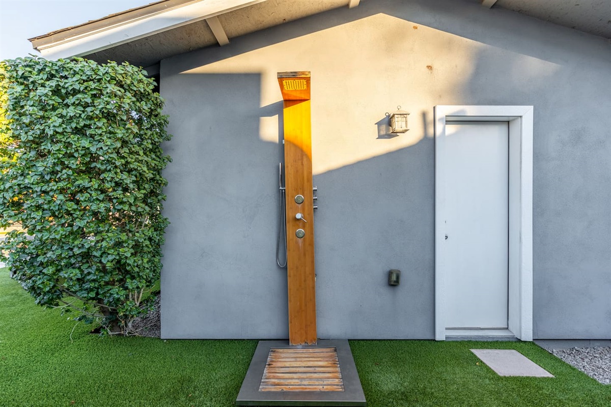 Outdoor backyard shower, providing a refreshing and private space to rinse off while enjoying the fresh air.