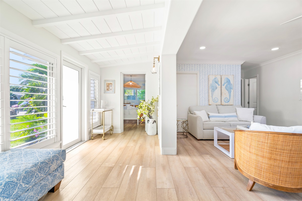 Coastal-chic textures and high-end wicker accents create a high-end boutique feel.