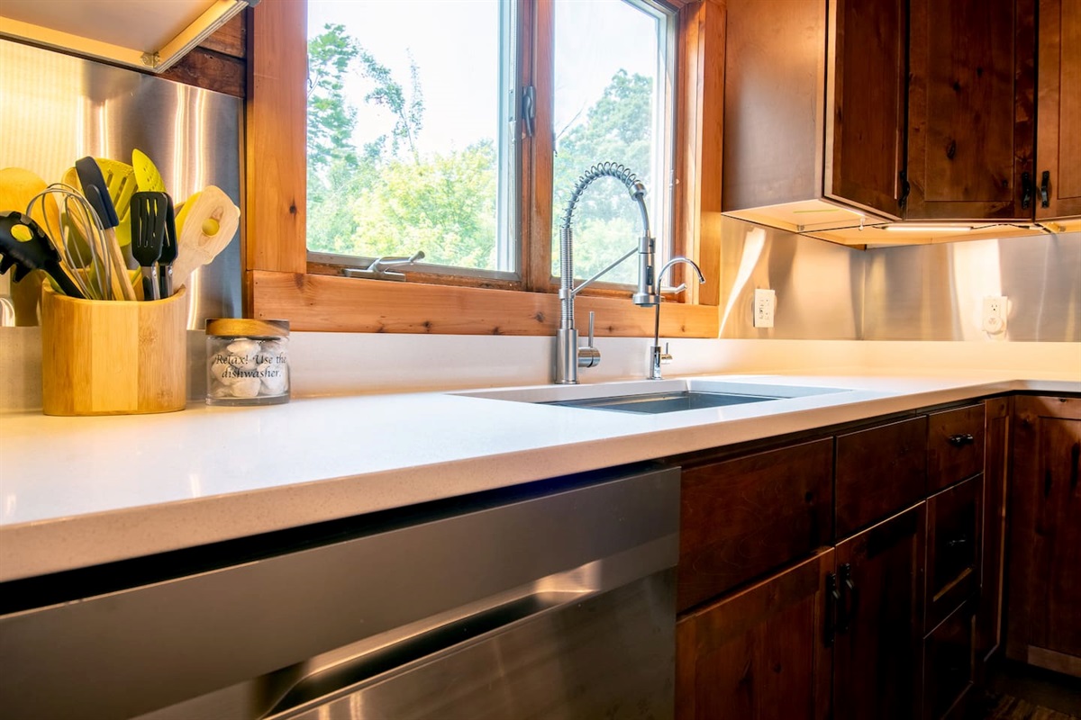 Relax and use the dishwasher! Sink has a pull down sprayer and a separate faucet that delivers reverse osmosis for drinking water.